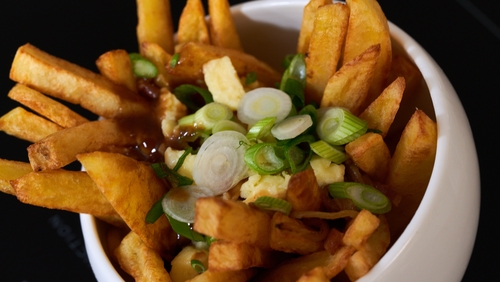 Irish Cheddar Cheese Curd Poutine with Smoked Bacon & Whiskey Gravy.