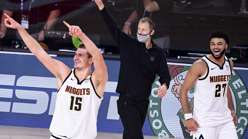 Michael Malone, Nikola Jokic (#15) and Jamal Murray (#27) of the Denver Nuggets celebrate their win