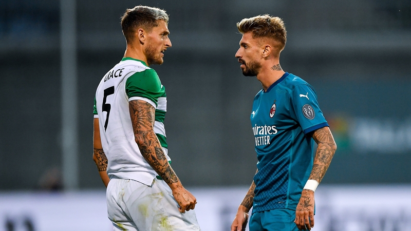 Lee Grace and AC Milan's Samuel Castillejo exchange viewpoints during the Europa League qualifier at Tallaght Stadium