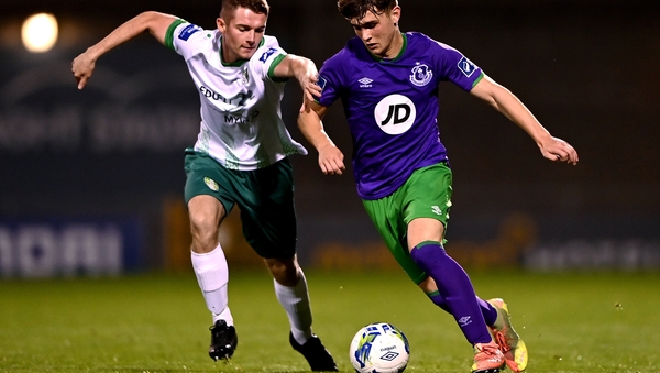 Cabinteely's Shane Barnes gets to grips with 15-year-old Shamrocks Rovers prospect Kevin Zefi