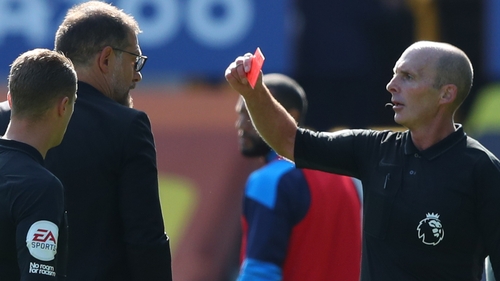 Referee Mike Dean shows Slaven Bilic a red card at Goodison Park