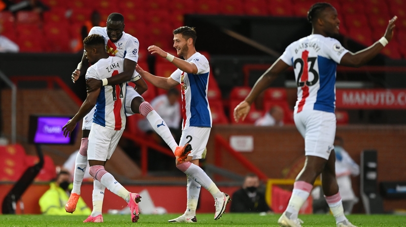 Wilfried Zaha is mobbed after scoring Crystal Palace's third goal