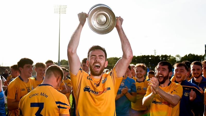 Kevin McLoughlin of Knockmore lifts the cup following victory over Breaffy