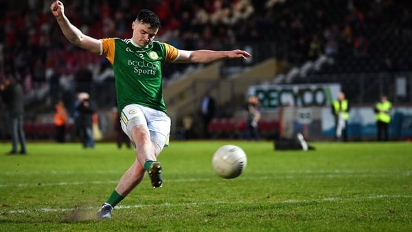 Ciaran Barker of Dungannon Thomas Clarkes kicks the winning penalty
