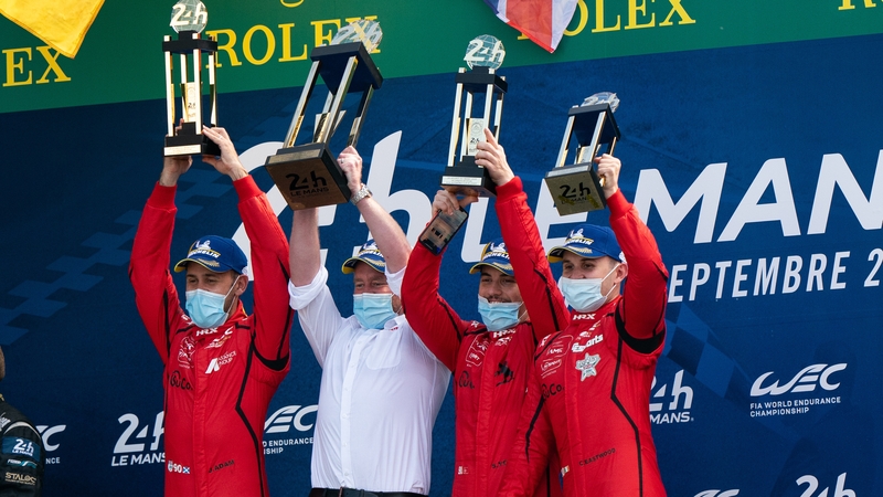 Charlie Eastwood and his team-mates celebrate on the podium. (Pic: @OfficialTFSport)