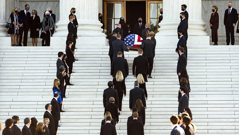 Pallbearers carry the flag-draped casket of the late US Supreme Court Justice Ruth Bader Ginsburg