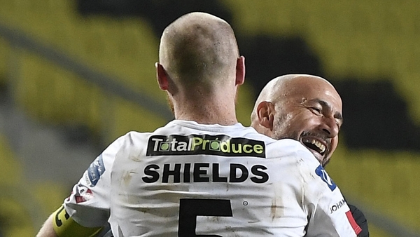Filippo Giovagnoli and Chris Shields embrace after the penalty drama