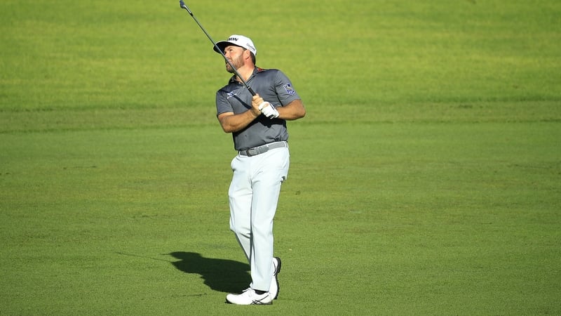 Graeme McDowell of Northern Ireland plays his second shot on the 13th hol