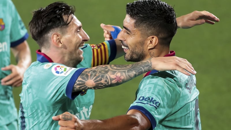 Leo Messi (L) with Luis Suarez