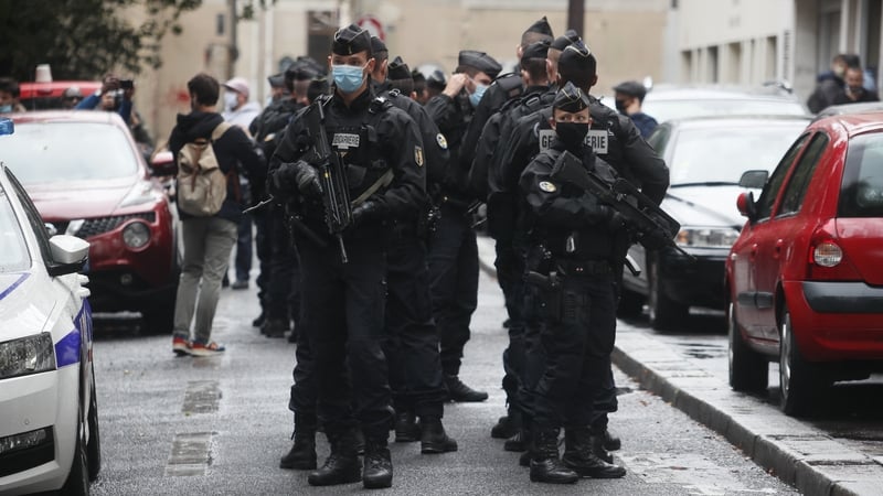 French security and medical workers on site after the attack in front of the former Charlie Hebdo headquarters in Paris