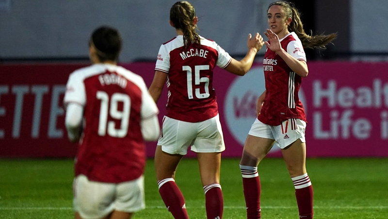 Katie McCabe (15) congratulates Arsenal's Lisa Evans on her hat-trick