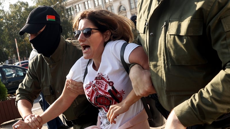 A woman is detained during the protest in Minsk, Belarus yesterday