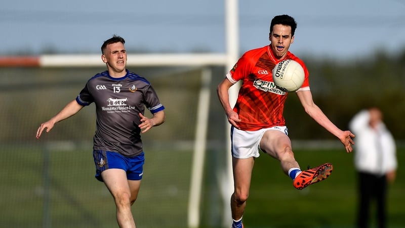 Karl Faulkner of Ardee St Mary's in action against Conor Whelan of Naomh Mairtin