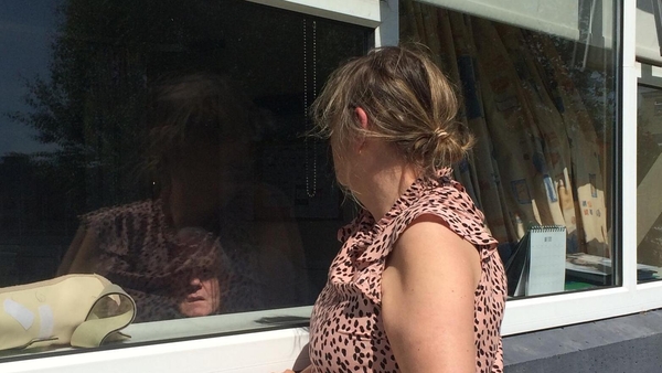 Mary McCarthy visiting husband Jimmy though a hospital window