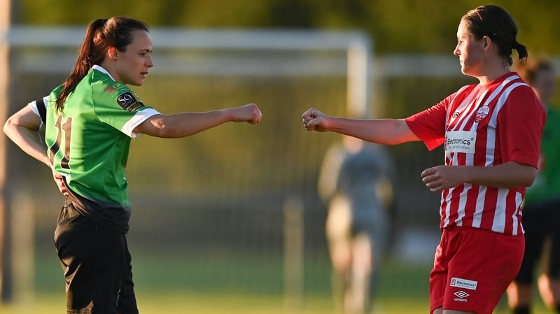 Áine O'Gorman (L) of Peamount United with Treaty United's Marie Curtin