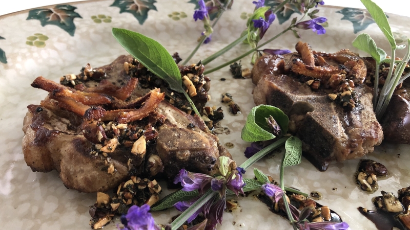 Rory's grilled pork with roast almond and sage leaf salsa and yellow apple sauce.