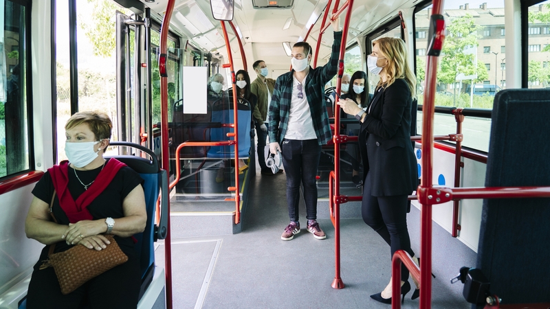 People wearing masks on a public bus in Spain