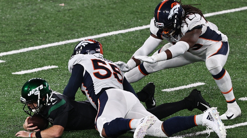 Sam Darnold #14 of the New York Jets is sacked by Bradley Chubb