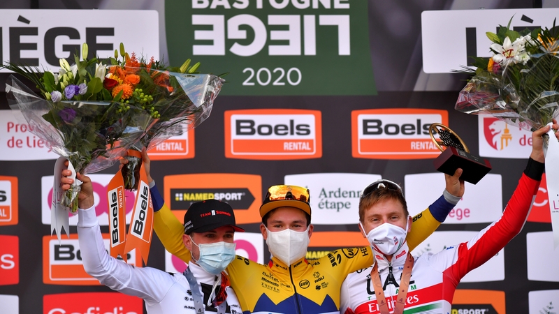 Roglic (c) celebrates victory