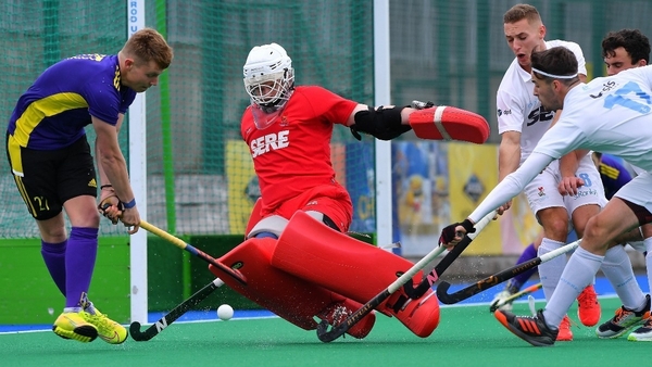 Lisnagarvey's James Milliken saves an effort from Pembroke's Isaac Johnson