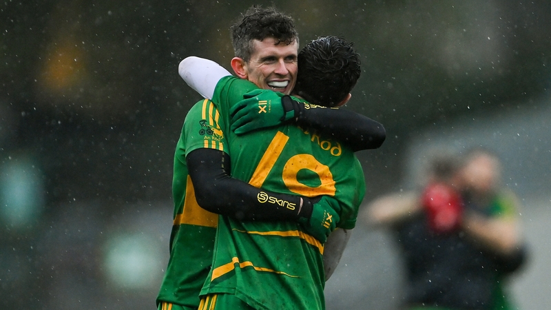 Rhode players Stephen Hannon, left, and Paul McPadden celebrate at the final whistle