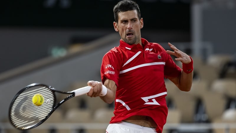 Novak Djokovic hits a forehand against Karen Kachanov