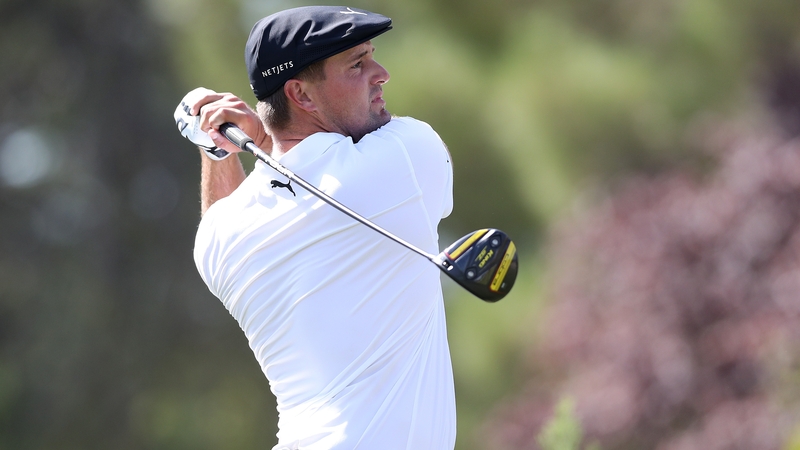 Bryson DeChambeau plays his tee shot on the ninth