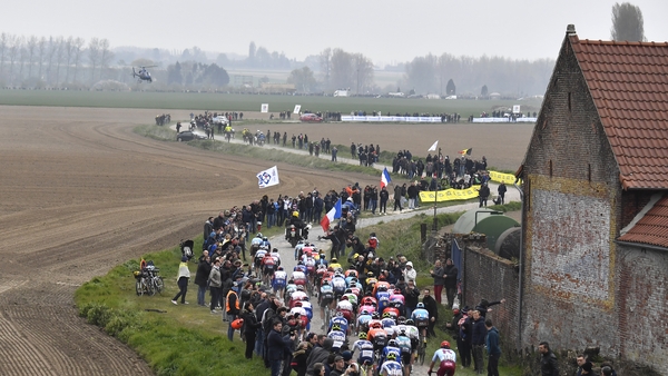 Riders race over the famed cobblestones during the 117th edition of the Paris-Roubaix in 2019