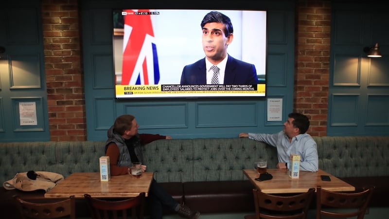 Customers at a pub in Manchester watch Rishi Sunak announce the latest job support. Cities such as Manchester are experiencing a surge in Covid-19 cases