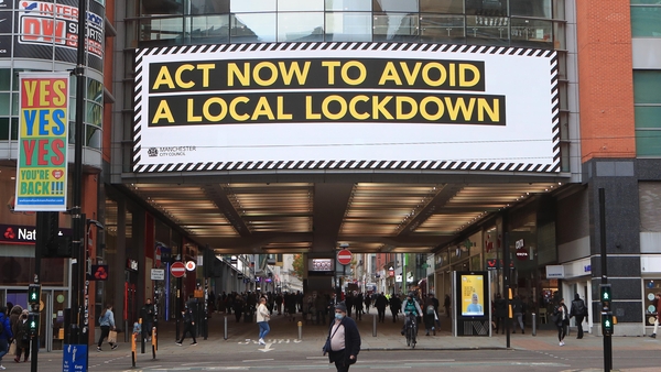 A sign in Manchester city centre urges people to act to avoid a local lockdown