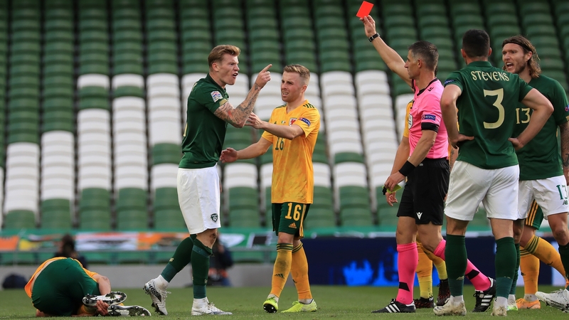 James McClean takes issue with the decision of Anastasios Sidiropoulos to give him his marching orders
