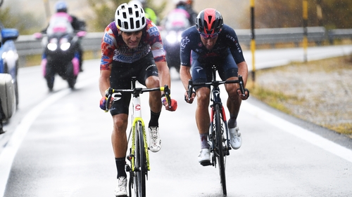 Ruben Guerreiro pedals through the rain on stage nine