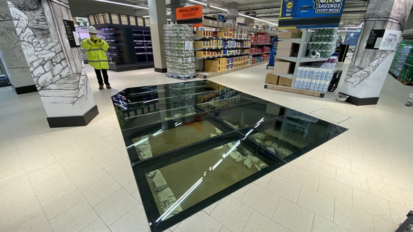 The remains of an 11th century house are displayed beneath a glass section of the floor of the new Lidl store in Dublin city centre