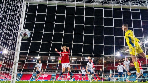 Erling Braut Haaland celebrates after Northern Ireland's Stuart Dallas puts the ball past Trevor Carson