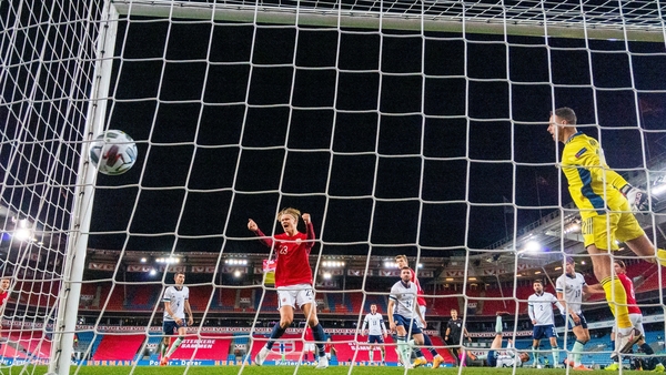 Erling Braut Haaland celebrates after Northern Ireland's Stuart Dallas puts the ball past Trevor Carson