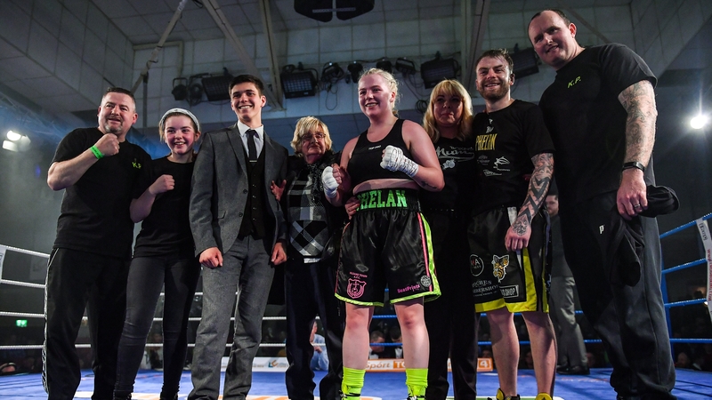 Katelynn Phelan with her family, including her brother and fellow professional Allen, after winning a super lightweight bout against Monika Antonik at the National Stadium in Dublin last year