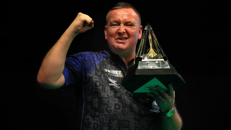 Glen Durrant hoists the Premier League trophy aloft