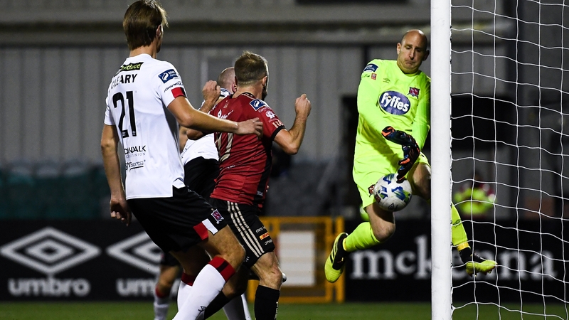 Dundalk stopper Gary Rogers makes a crucial save from a Keith Wards shot