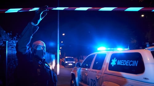 Police cordon off the scene of the stabbing in Conflans Saint-Honorine, Paris last night