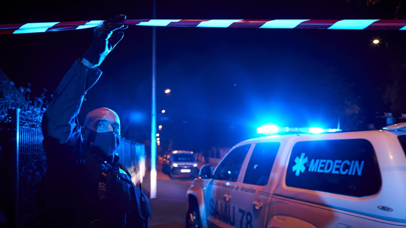 Police cordon off the scene of the stabbing in Conflans Saint-Honorine, Paris last night