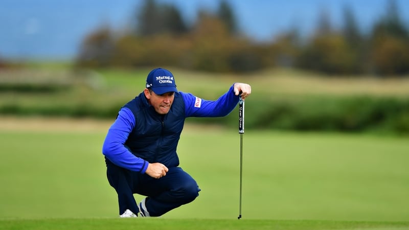 Padraig Harrington lines up a putt on the 4th green