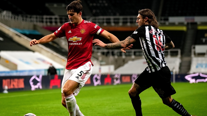 Harry Maguire shielding the ball from Newcastle and Ireland's Jeff Hendrick