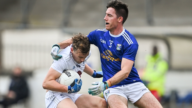 Darragh Kirwan of Kildare (l) is tackled by Cavan's Killian Brady