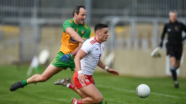 Michael McKernan of Tyrone in action against Michael Murphy of Donegal