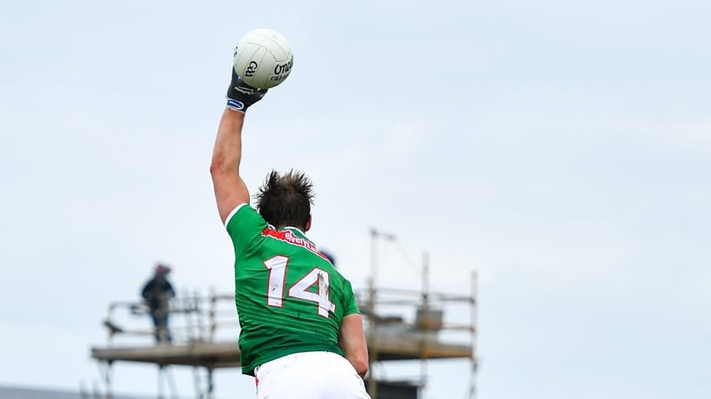 Aidan O'Shea climbs above Séan Andy Ó Ceallaigh of Galway