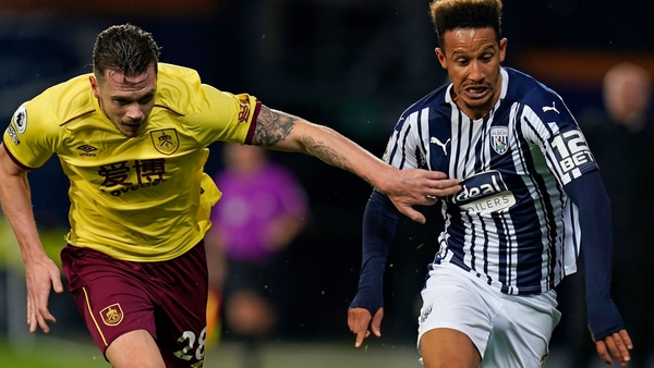 Ireland internationals Kevin Long (l) and Callum Robinson tussle for possession