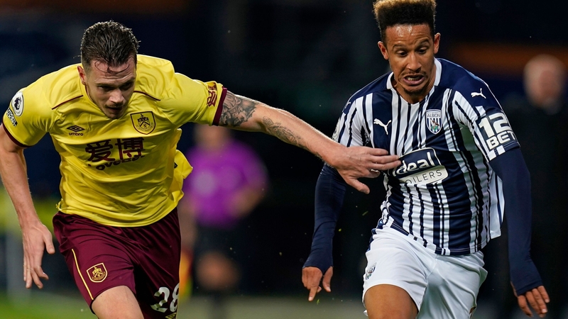 Ireland internationals Kevin Long (l) and Callum Robinson tussle for possession