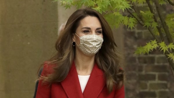 The Duchess of Cambridge cut a striking figure in the elegant full-length red coat. Photo: Getty