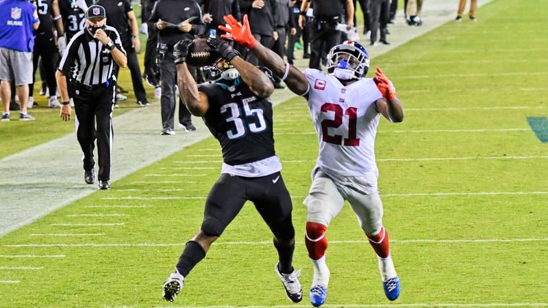 Philadelphia Eagles' Boston Scott (No 35) beats Jabrill Peppers for a touchdown reception