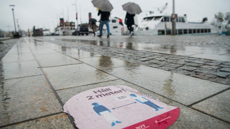 A social distance sign in Stockholm in Sweden